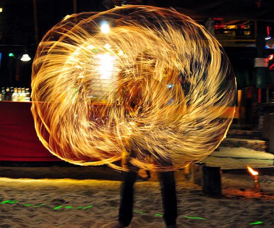 backpacker in southeast asia: fire dancing