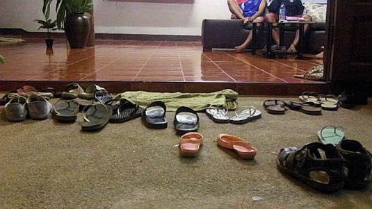 backpacker in southeast asia: shoes offf