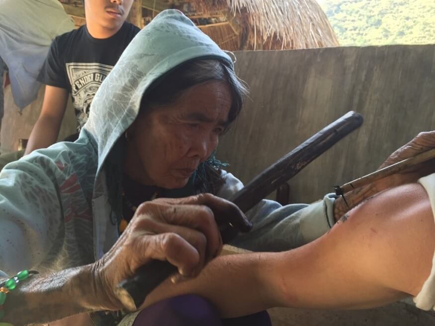 how to get a tribal tattoo from the legendary Whang Od (c) Will Hatton / Broke Backpacker