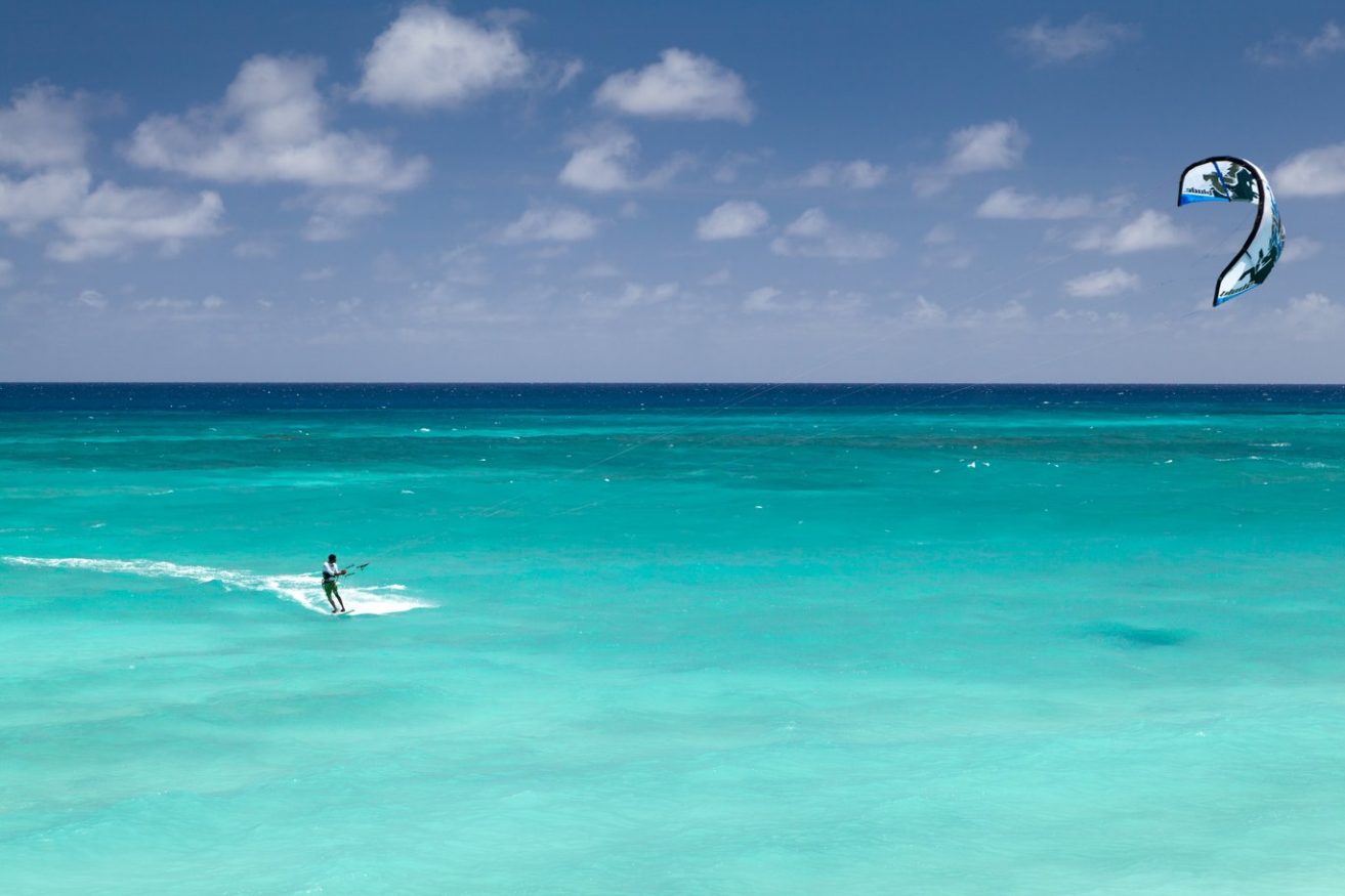 Tanzania Travel Guide - Kite surfing on crystal clear turquoise water
