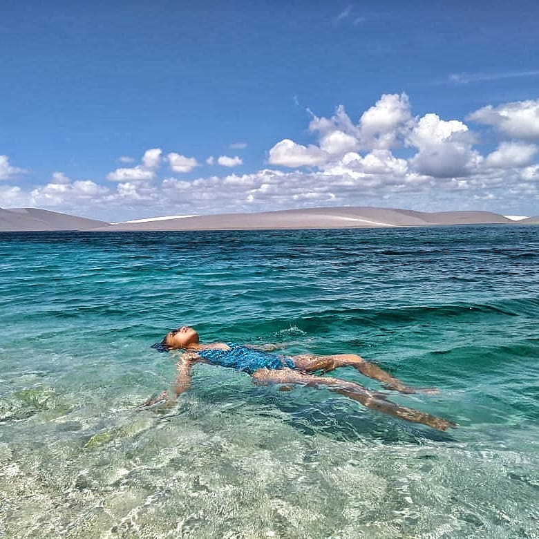 best places to visit in brazil, girl swimming in lake at Lençois National Park, Maranhão