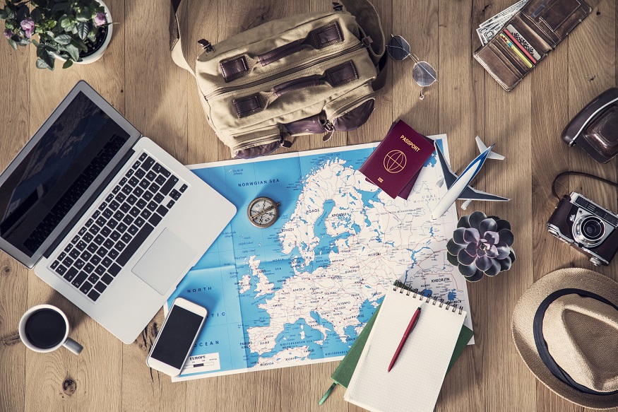 New Year's travel resolutions - laptop and map