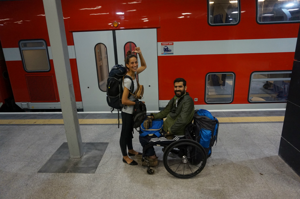 travelling in a wheelchair carrying bags