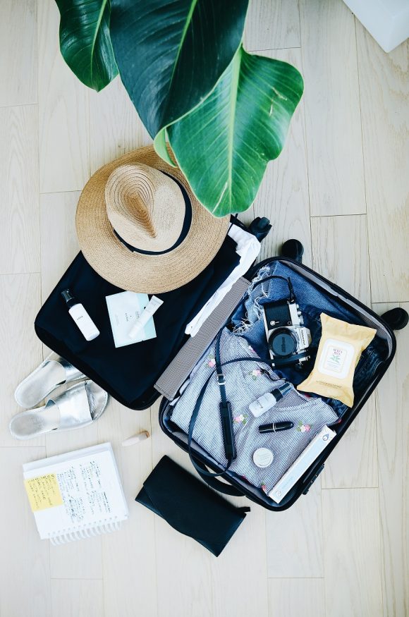 autsim travel - packing - hat and suitcase