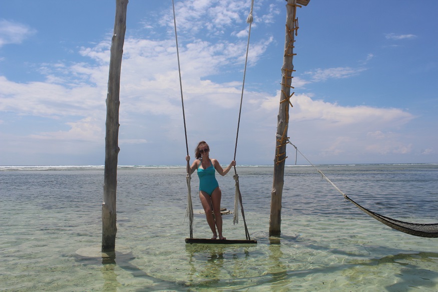where to stay in bali - what to do gili islands - swing in ocean