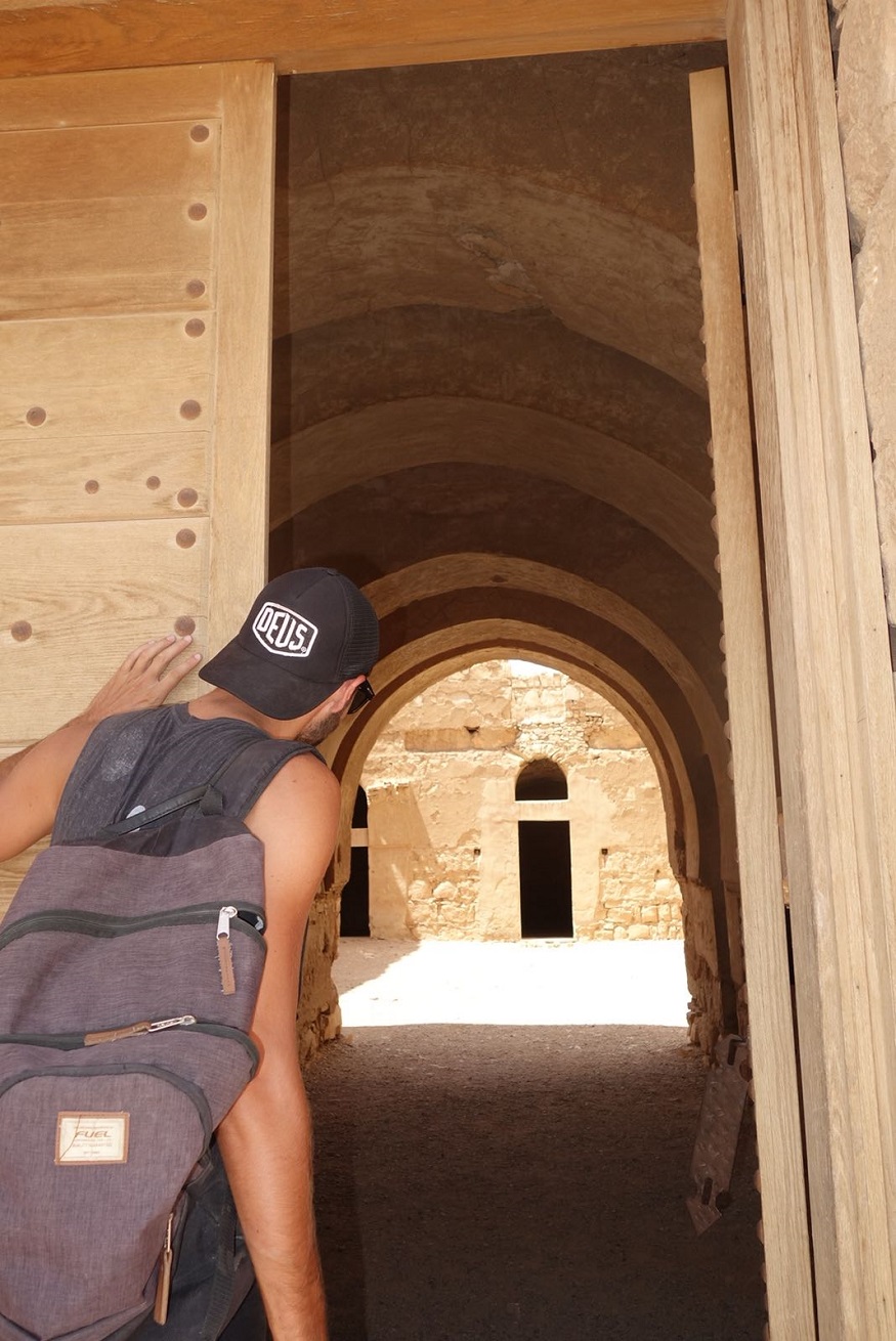 backpacking jordan - backpacker looking through an entrance