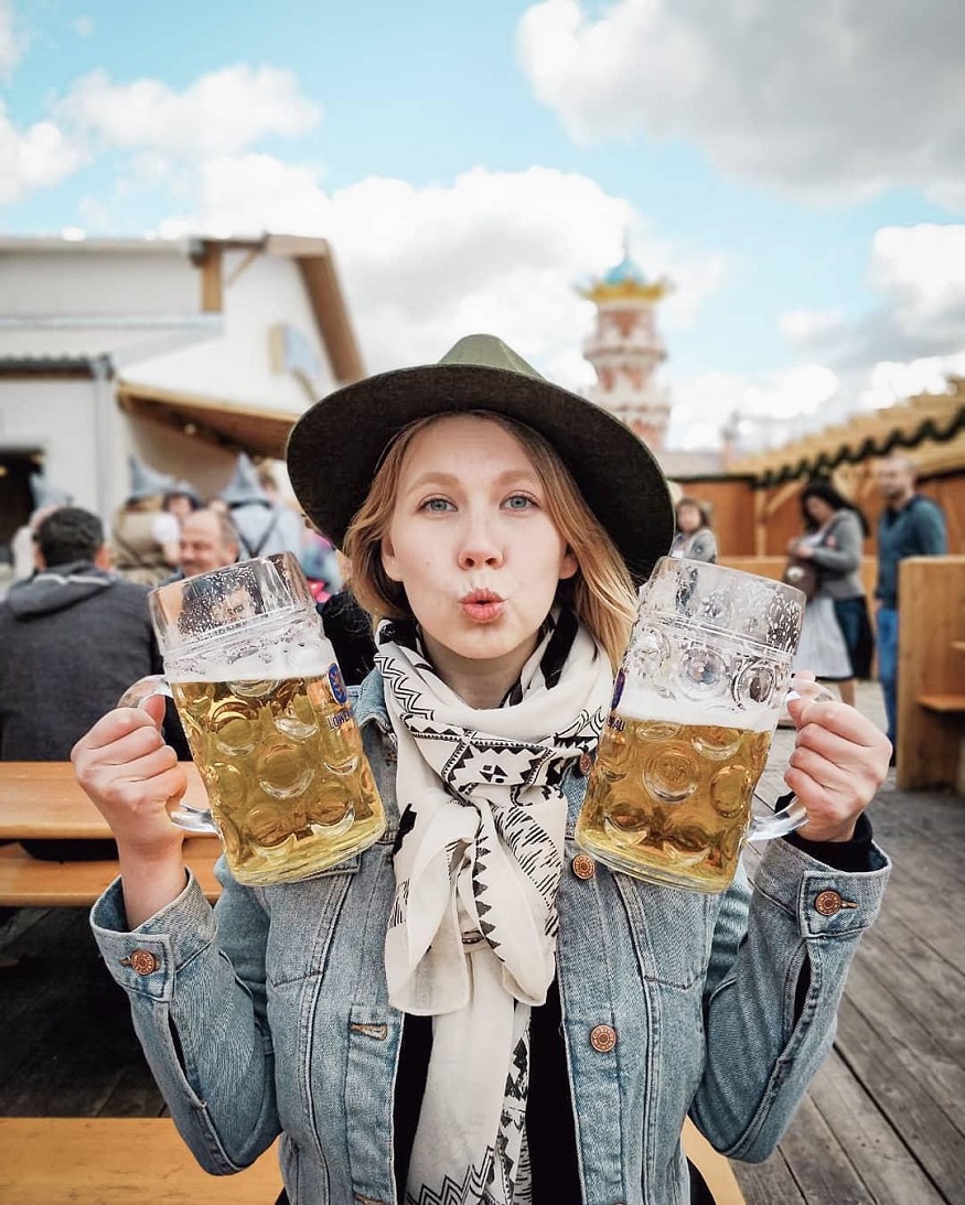 best beer in europe - woman holding two beer tankards