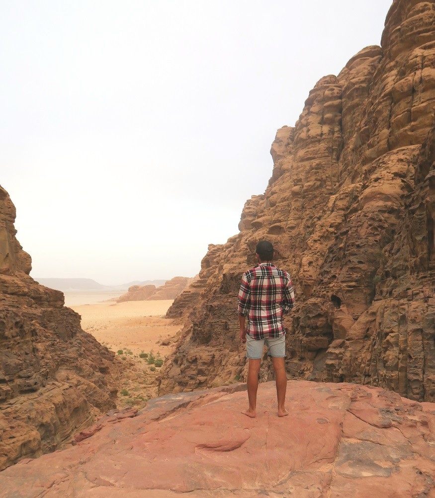backpacking jordan - man standing on a rock