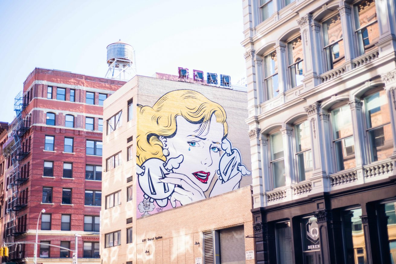 Where to stay in New York - mural woman crying Photo by Mercedes Álvarez on Unsplash @mercedesalvarez