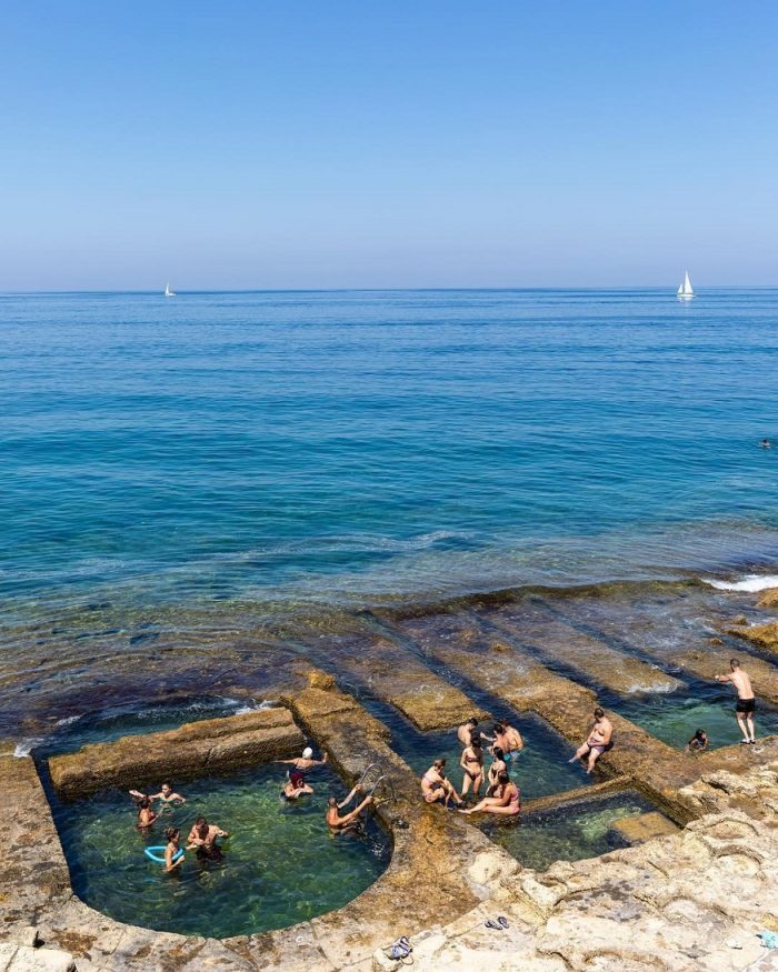 things to do in Malta - people bathing in the sea