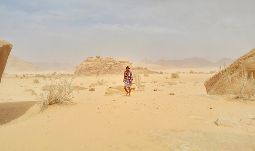 backpacking jordan - man in the middle of the desert 