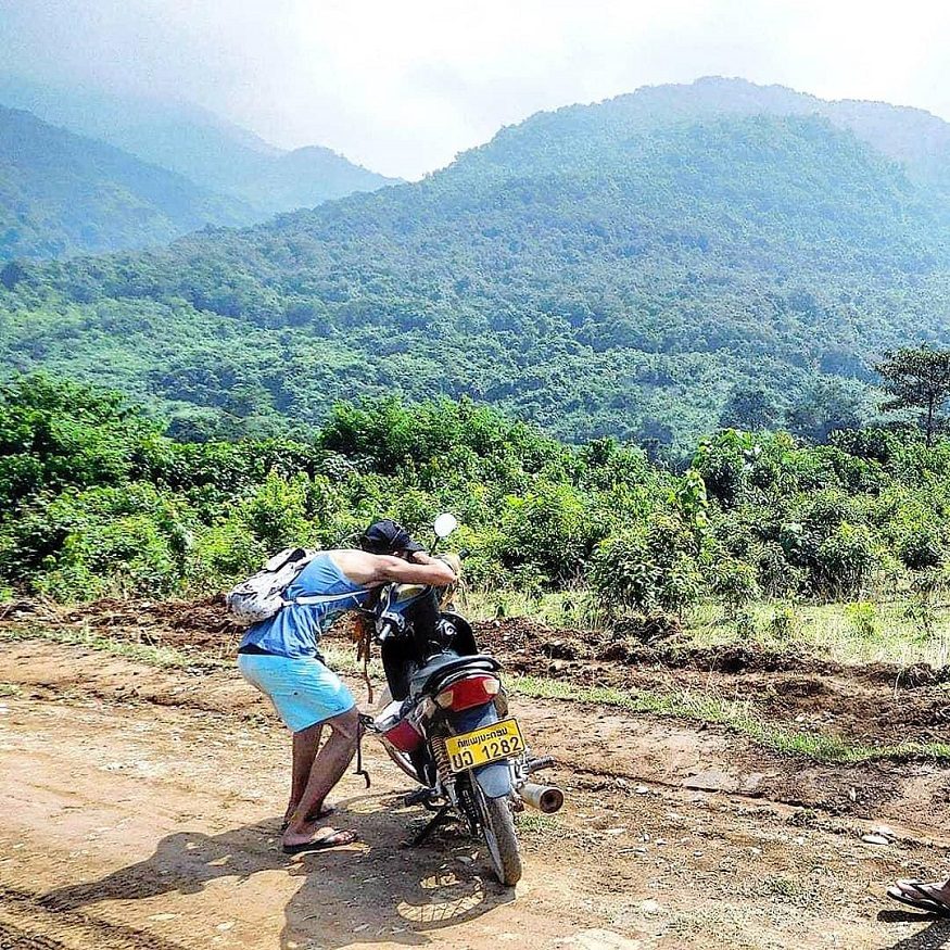 backpacking Laos -best time to visit Laos - motorbike by mountain view