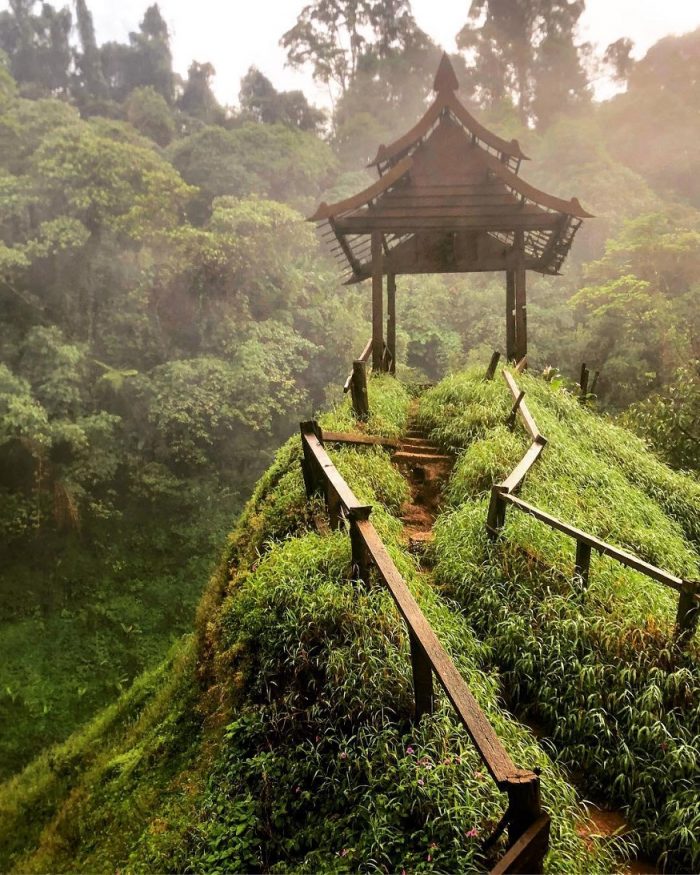 backpacking Laos - Bolaven Plateau - hill top with temple shelter