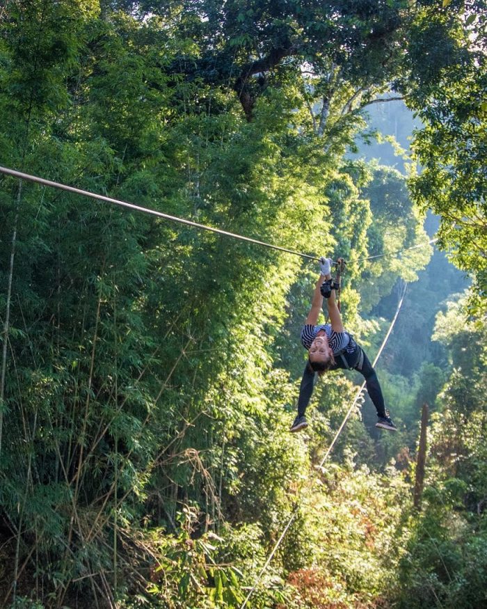 backpacking Laos - girl on zip line