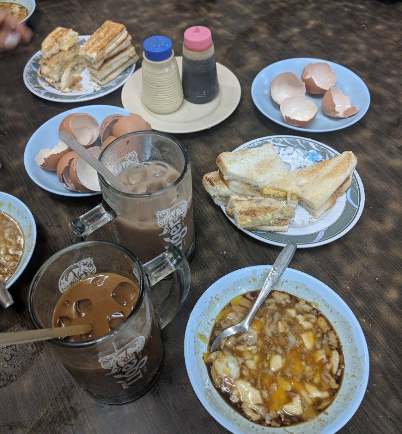 backpacking singapore - singapore food with iced coffee and eggs