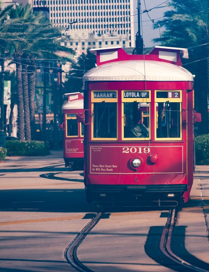 where to stay in new orleans, picture of a red tram
