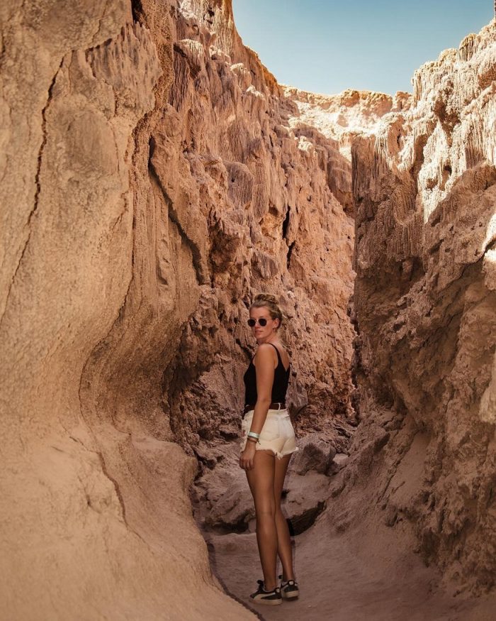 backpacking chile, girl standing in cave in san pedro de atacama