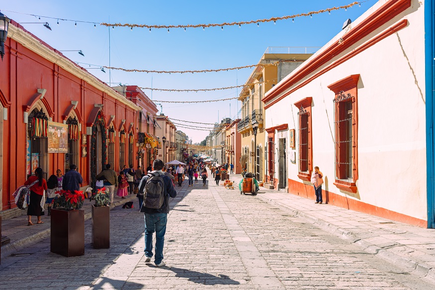 day of the dead facts, man walking down street in Oaxaca