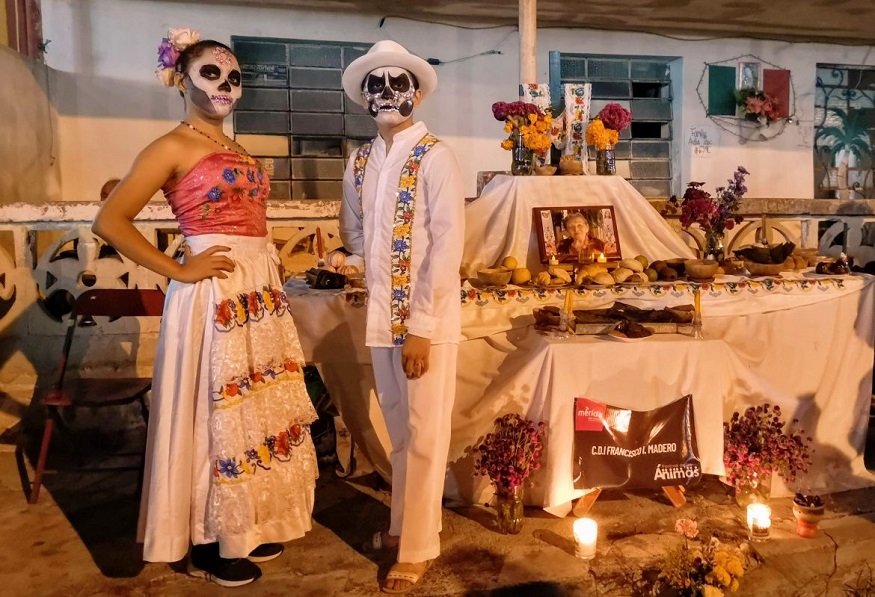 Day of the Dead facts, two people in traditional mexican dress with skeleton faces
