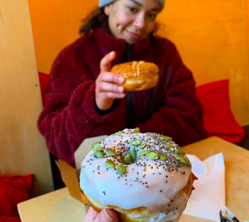 edinburgh on a budget, a vegan donut with white icing and seeds at Considerit Chocolate