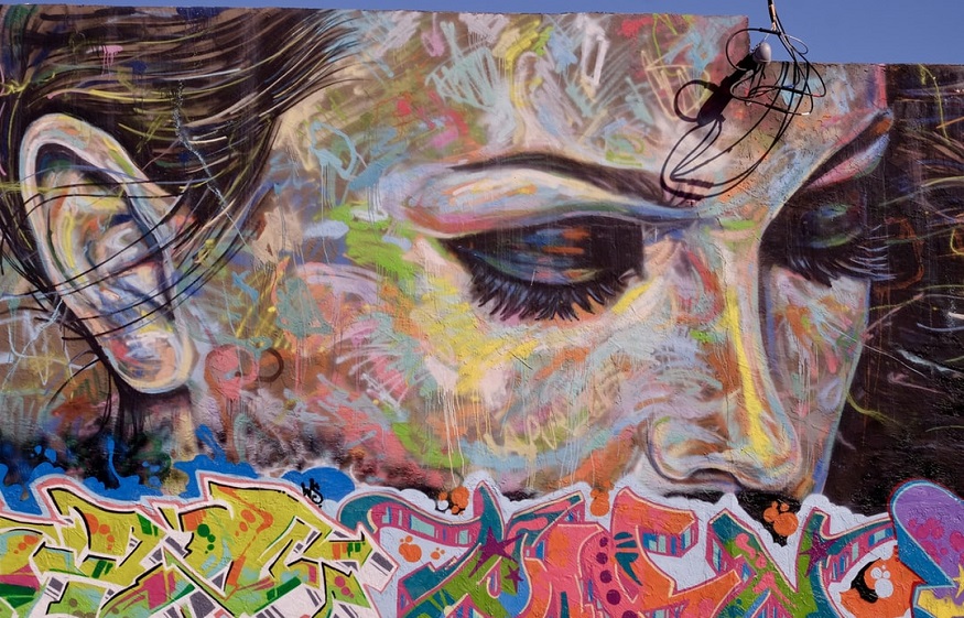 where to stay in miami - a person's face painted at Wynwood Walls