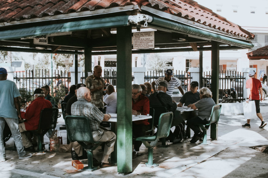 where to stay in miami - group of men sitting together in Little Havana