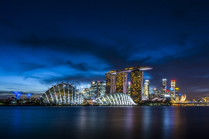 where to stay in singapore -view of marina sands bay hotel at night from the water