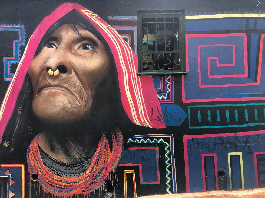 best places to visit in colombia, graffiti of a women's head in bogota