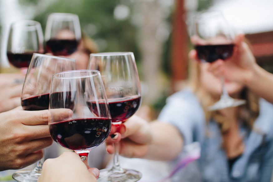 things to do in luxembourg, people raising their glasses of red wine
