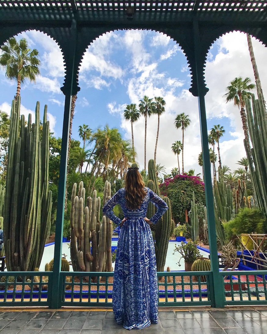 best romantic destinations for solo travellers, girl in blue dress by cactus garden in marrakech