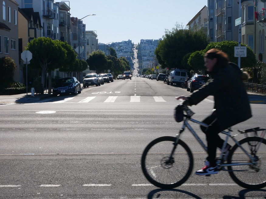 backpacking california, person on a bike in san francisco