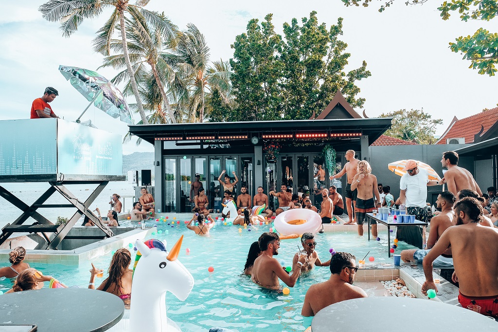 wish-listed hostels -people in the pool at Lub d hostel at Koh Samui Chaweng Beach