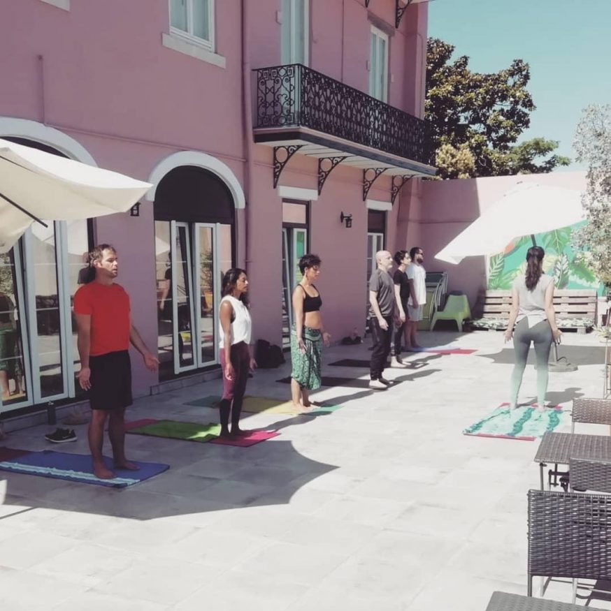 hostels are open - yoga class on the terrace in the sun