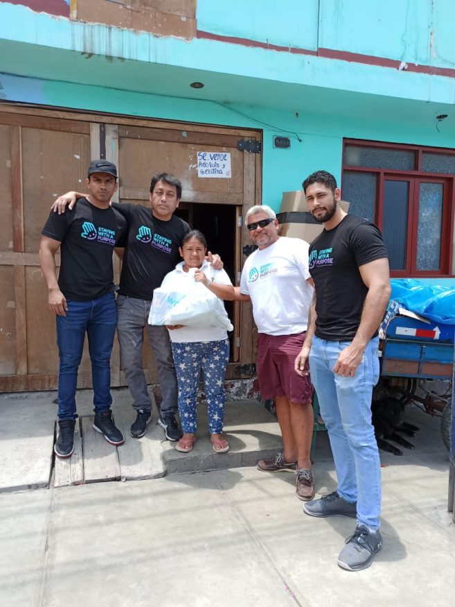 A local woman getting help from the team at the prime spot backpacker's hostel in Peru , nominated for extraordinary hostel heroes award