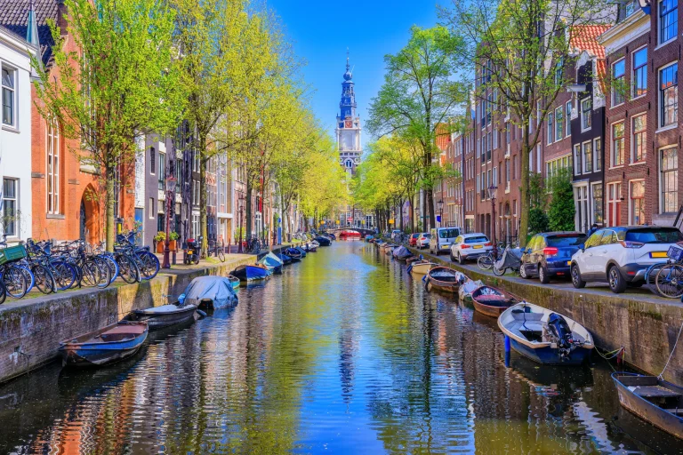 Amsterdam, Netherlands. Groenburgwal canal with Zuiderkerk tower in the background