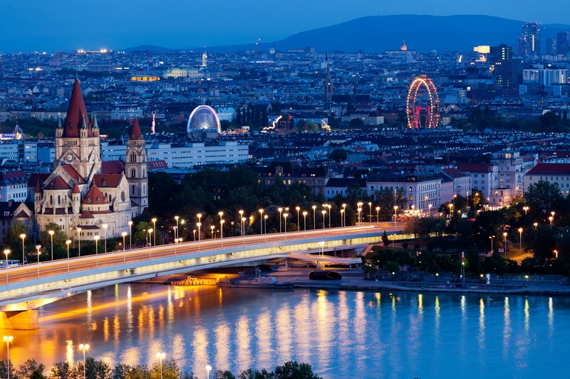 Vienna, Austria Aerial View at Night with Danube and Cityscape - Safest Countries for Solo Female Travelers