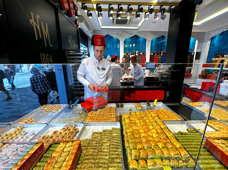 Baklava Seller at Taksim Square - Best Areas to Stay in Istanbul