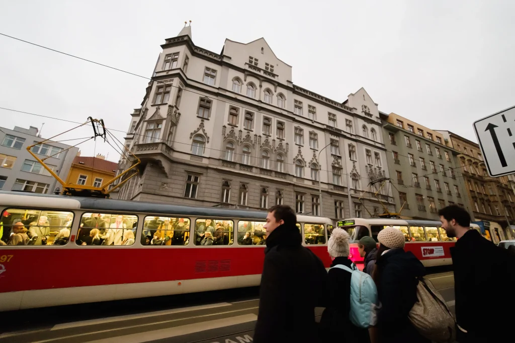 people watching the train go by in prague
