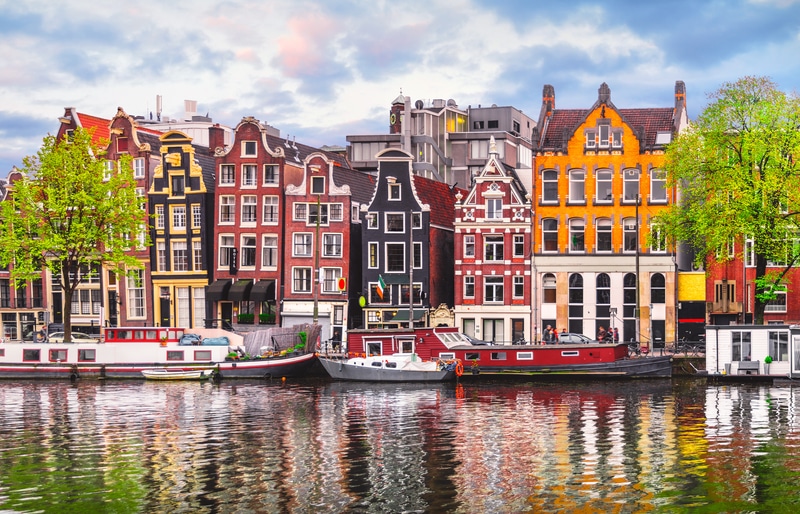 Amsterdam Netherlands Dancing Houses over river Amstel - Safest Countries for Solo Female Travelers