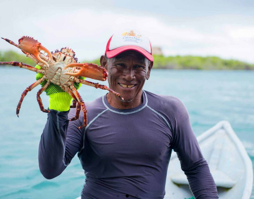Man with Seafood at Casa en el Agua Hostel