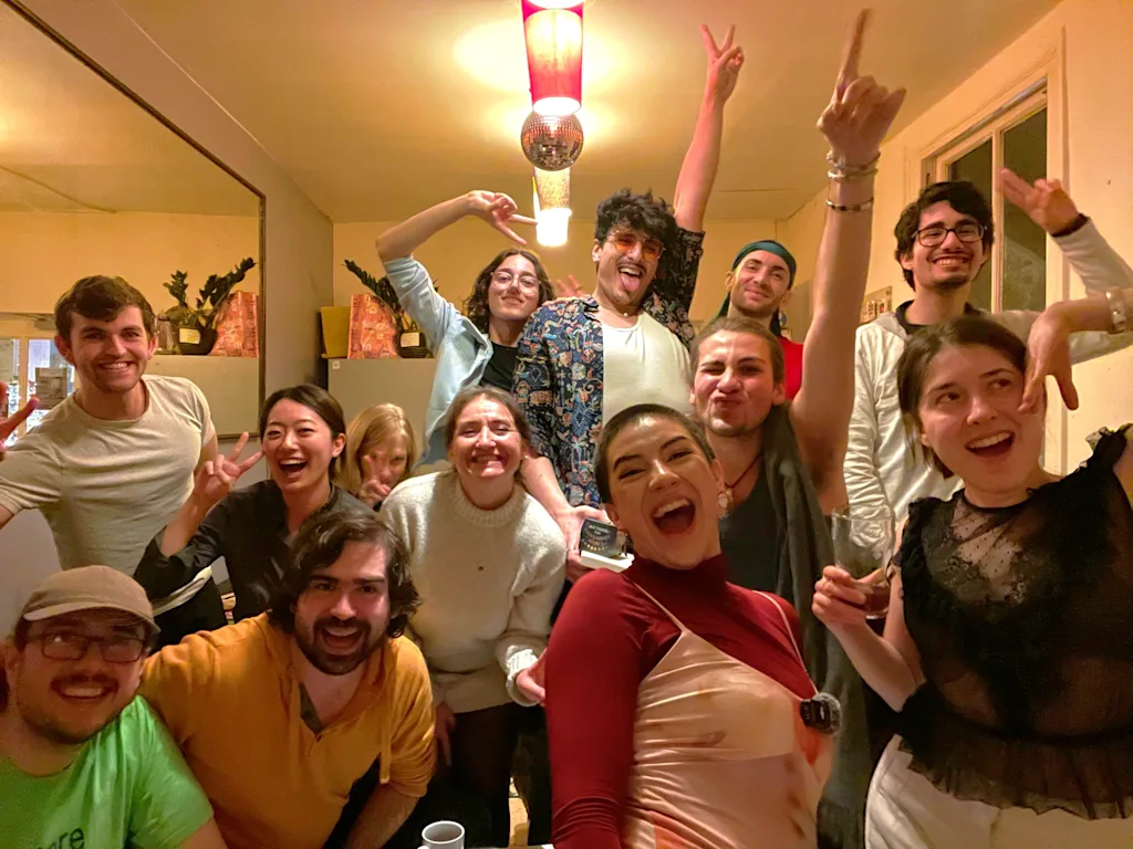 people posing for a selfie together at a hostel