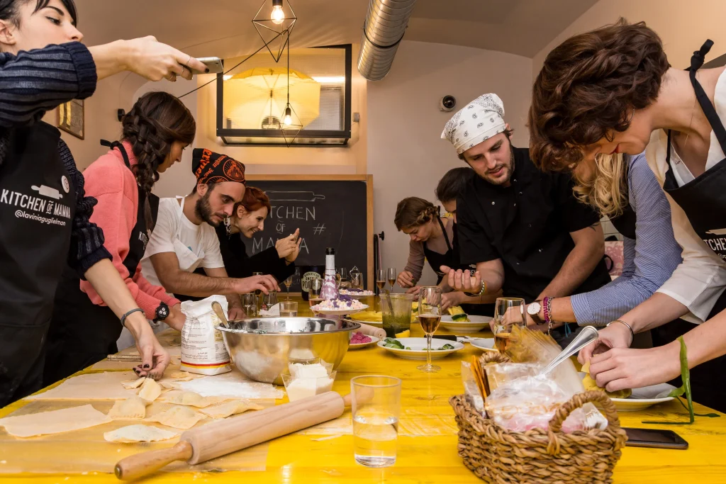 cooking class with a group of people making pasta