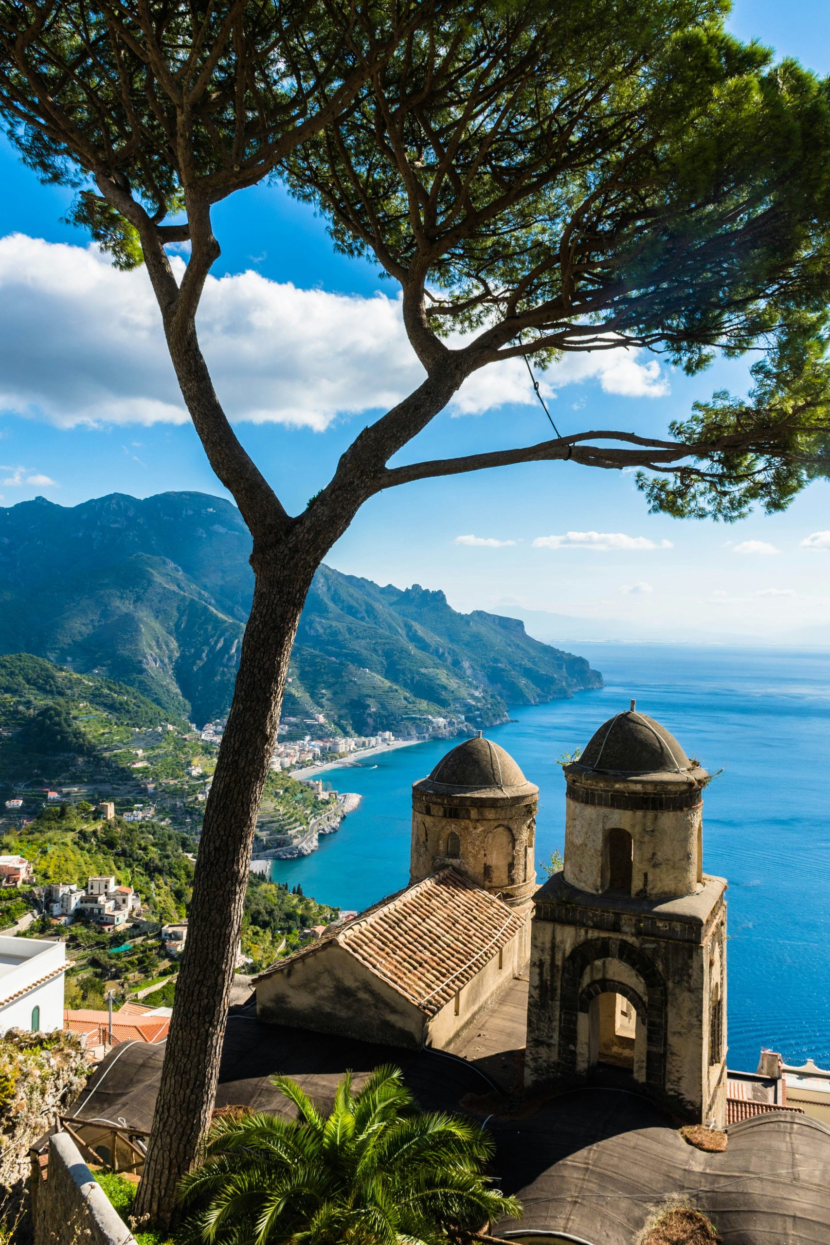 a scenic view of the ocean and mountains