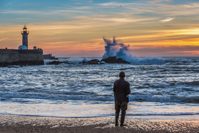 Solo Traveller Standing at Foz do Douro Beach - Best Areas to Stay in Porto