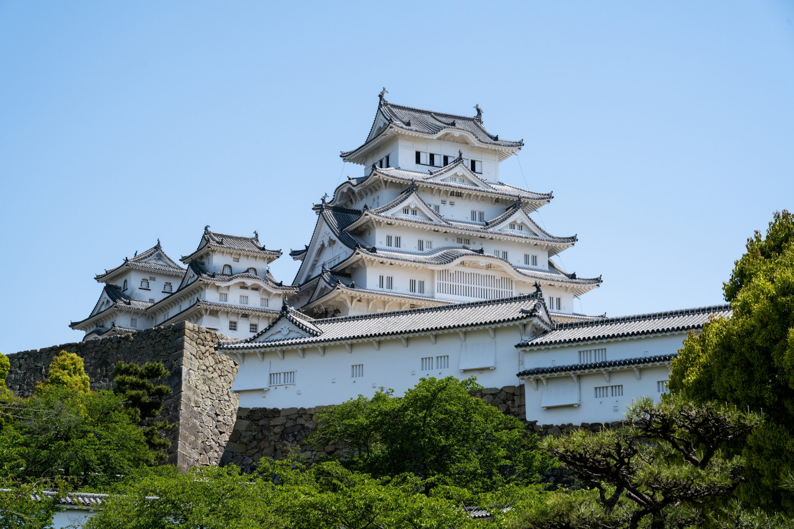 a majestic white castle stands proudly, in himeji, japan, day trips from kyoto
