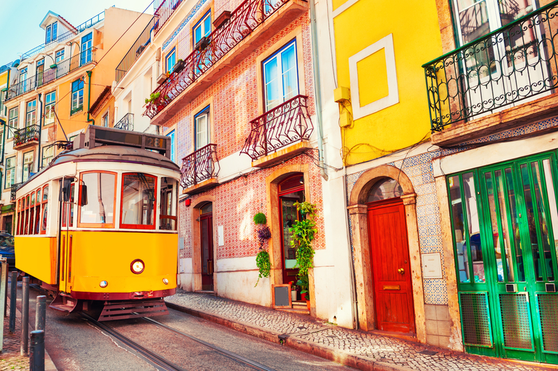 Lisbon Street View with Tram and Colourful Houses - Cheap Places for Female Solo Travel