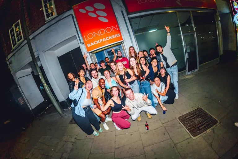 people posing for a photo in front of hostel