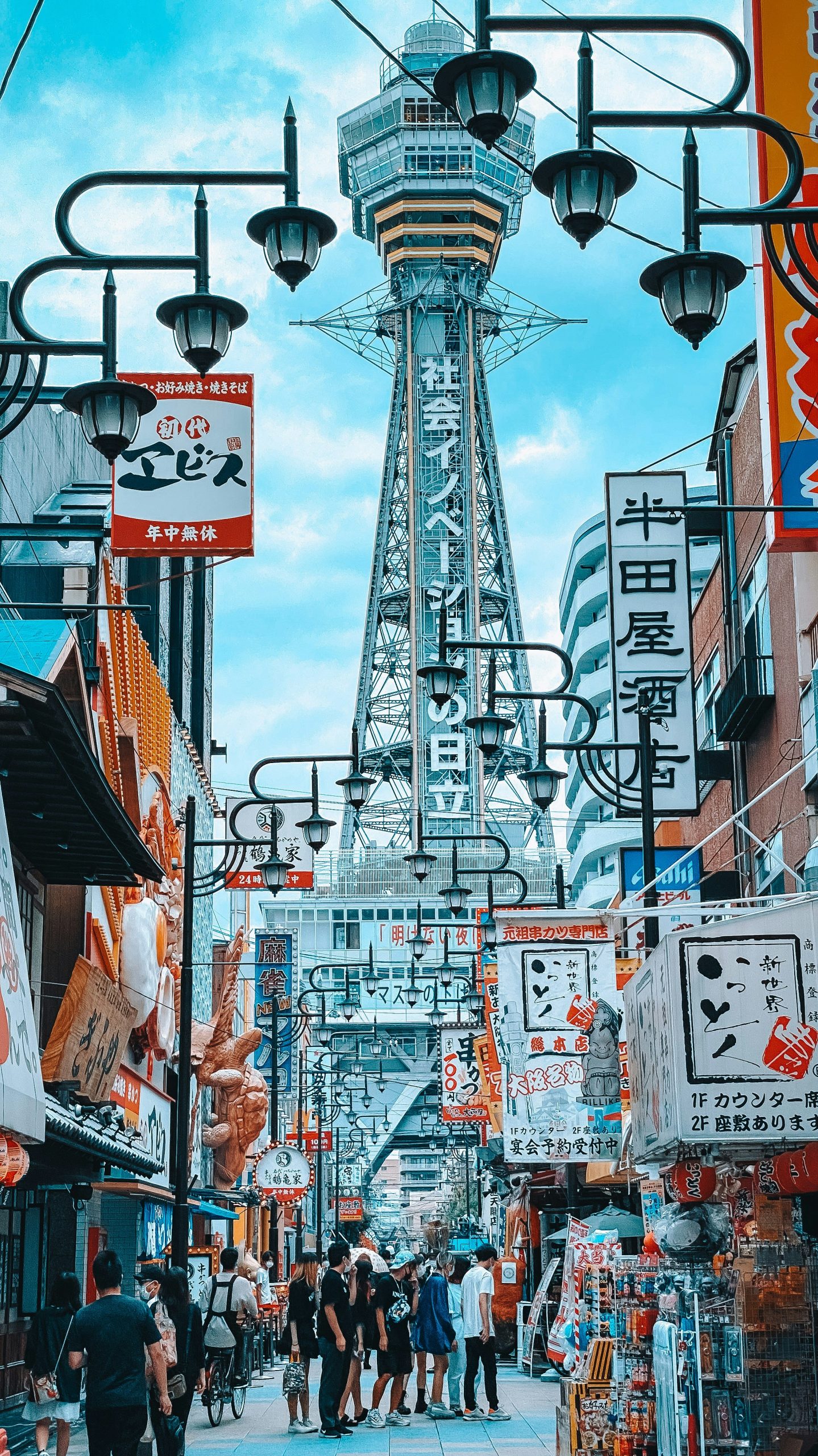 people walking on street in daytime, in osaka, day trips from kyoto