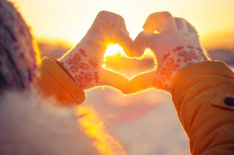 Heart Made With Hands in Winter Clothes - Solo Travel Packing List for Winter